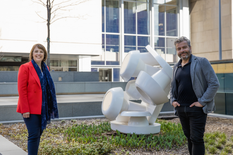 Annik Desmarteau, Vice-President, Offices Québec at Ivanhoé Cambridge and John Zeppetelli, Director and Chief Curator at the MAC at the Esplanade PVM. In the background: the work Luna-Park, 1967, by artist Lise Gervais. Fiberglass and polished metal, 196 x 205 x 160 cm Collection Musée d'art contemporain de Montréal.
